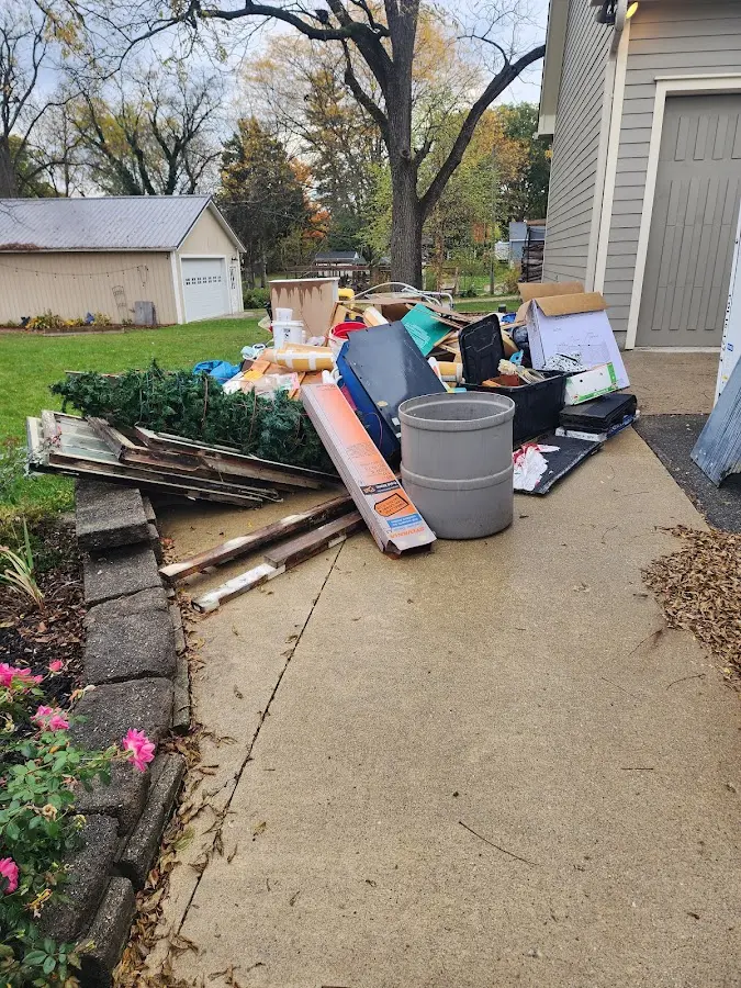 Dumpster being loaded with debris for Estate Cleanout Dumpster Rental in Westerville